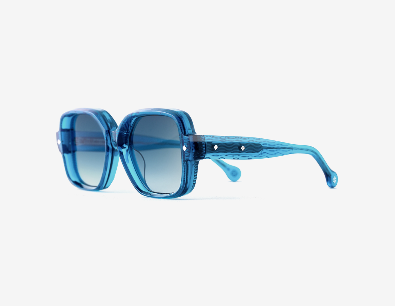 Luxury Japanese eyewear – Bellesguard Cerulean Clarity sunglasses, acetate in Cerulean Clarity, Sea Fusion lenses, Platinum plating, Filter Category 2, left view.