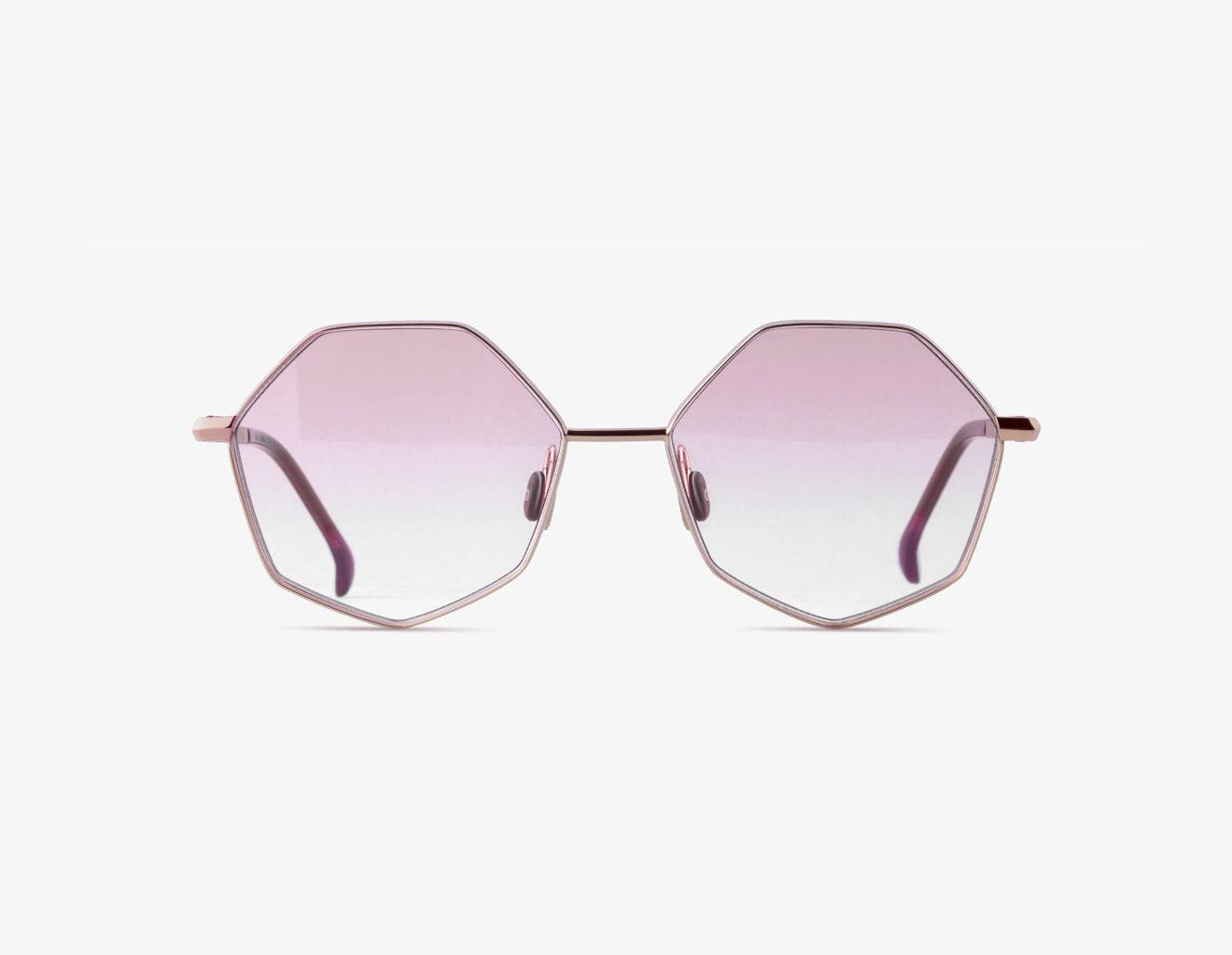 Designer titanium geometric butterfly red carpet eyewear Palla in 18k Rose Gold with Ruby Glow lenses and Currant Essence acetate.