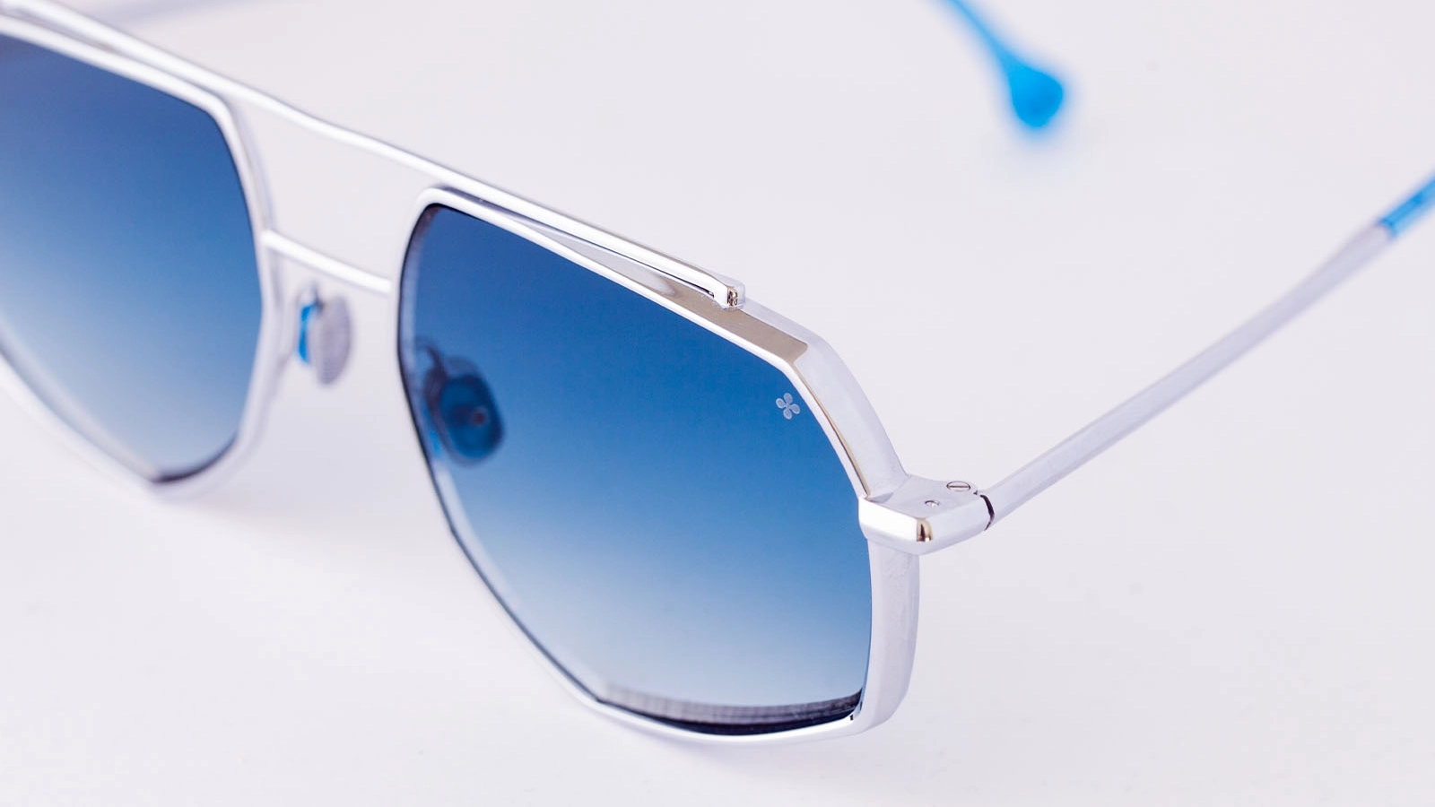 Block titanium eyewear profile showing sculpted bevel and dimensional side geometry