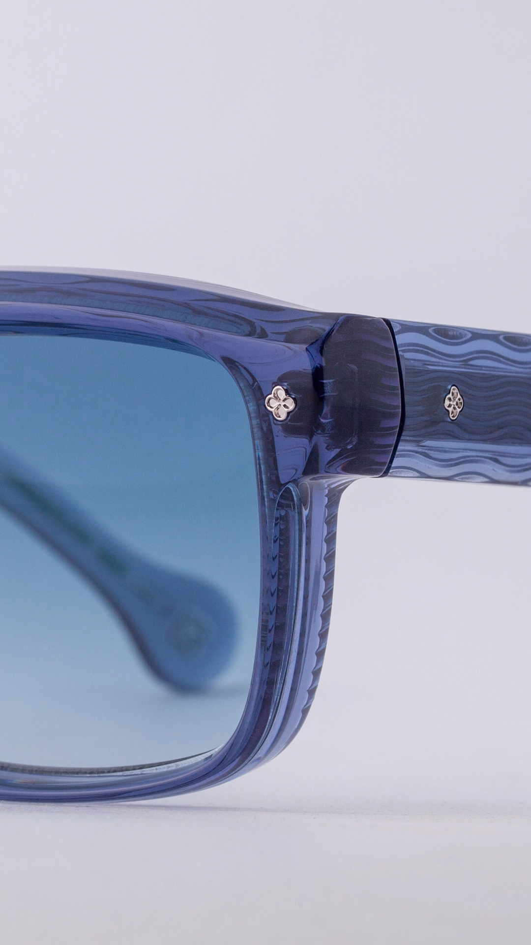 Tres Dragons acetate sunglasses showing wave-pattern temple detail and Japanese craftsmanship