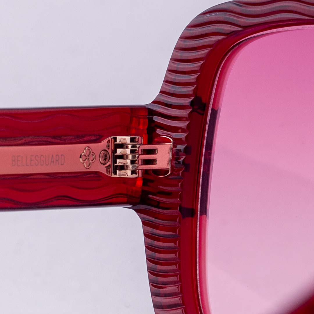Red acetate hinge detail with Barcelunettes flower mark